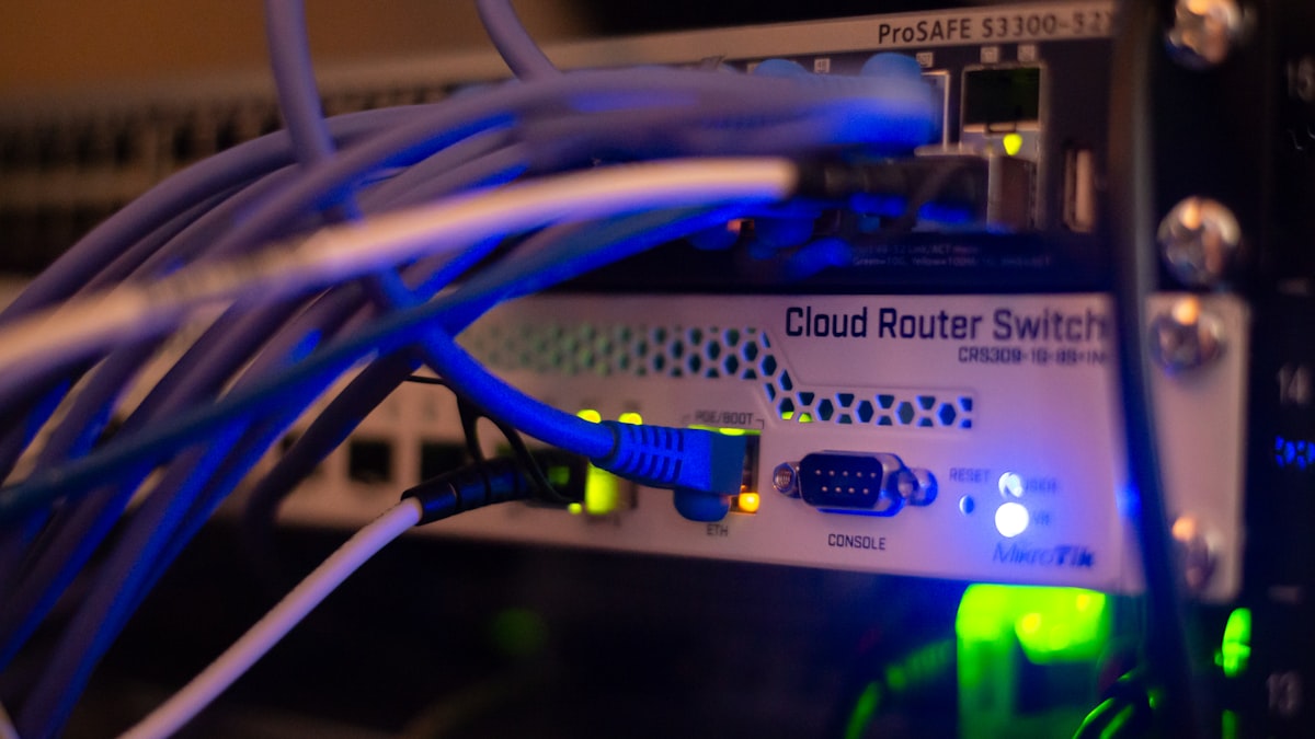 A close-up of a network switch with cables connected
