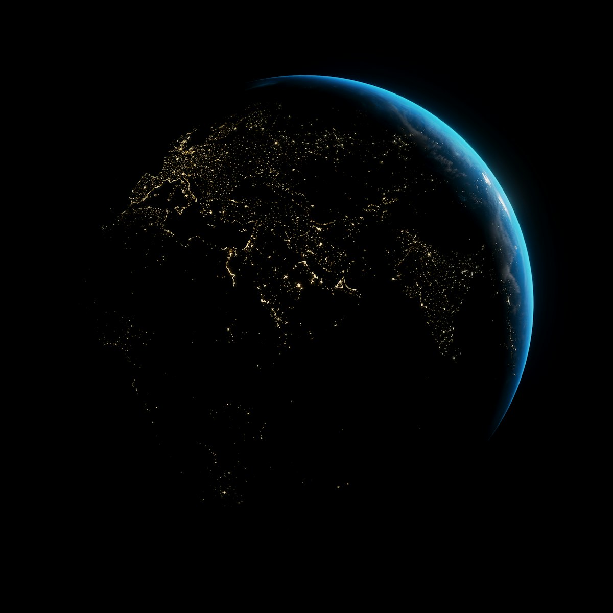 Earth at night showing city lights across continents
