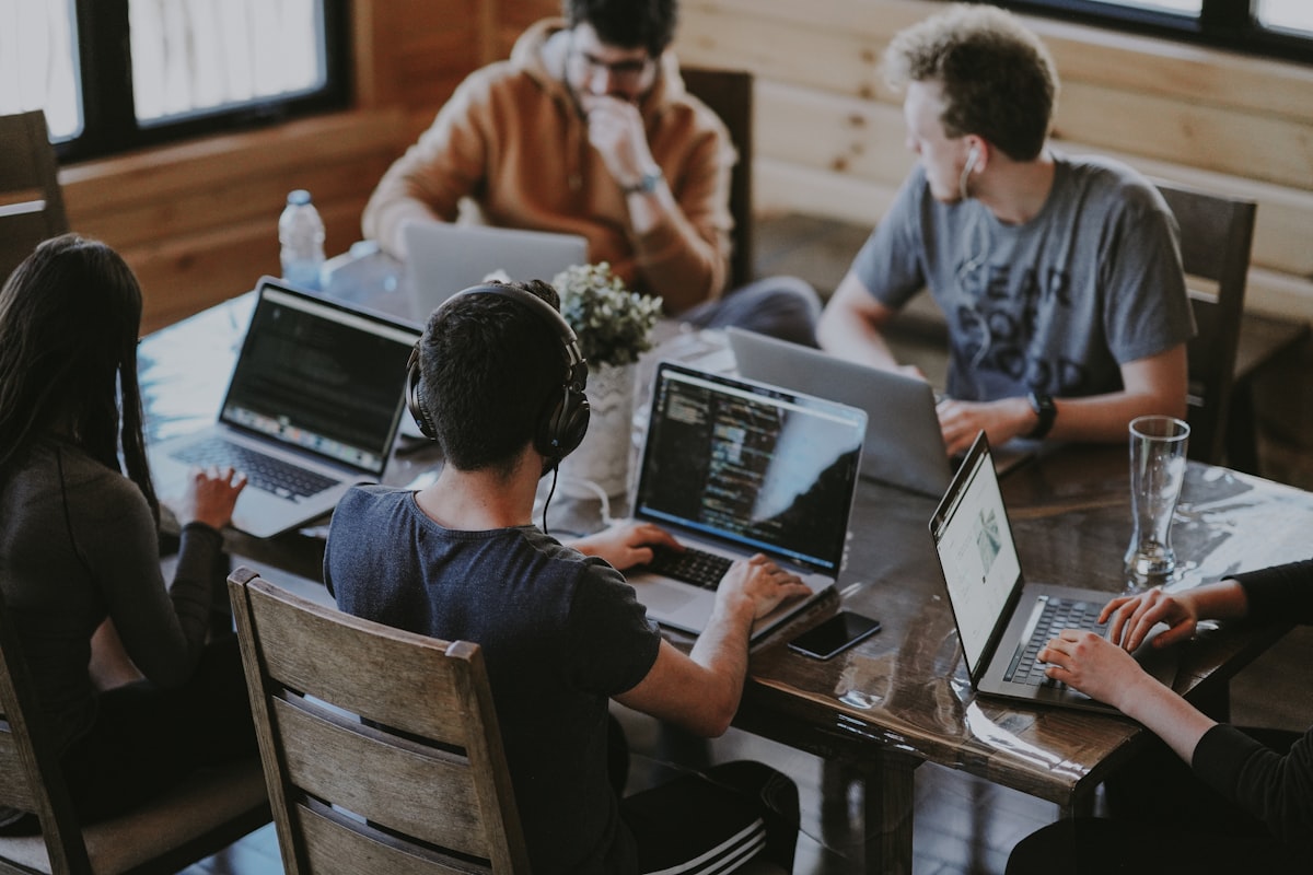 A team collaborating on a laptop